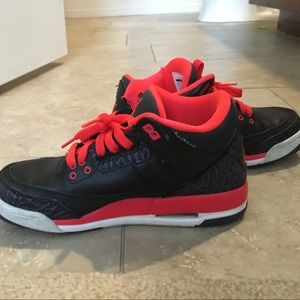 Nike Jordan's black, orange and purple