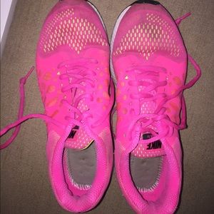 Pink Nike Pegasus running shoes
