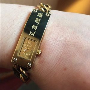 Gold watch. LAMB. Reserved