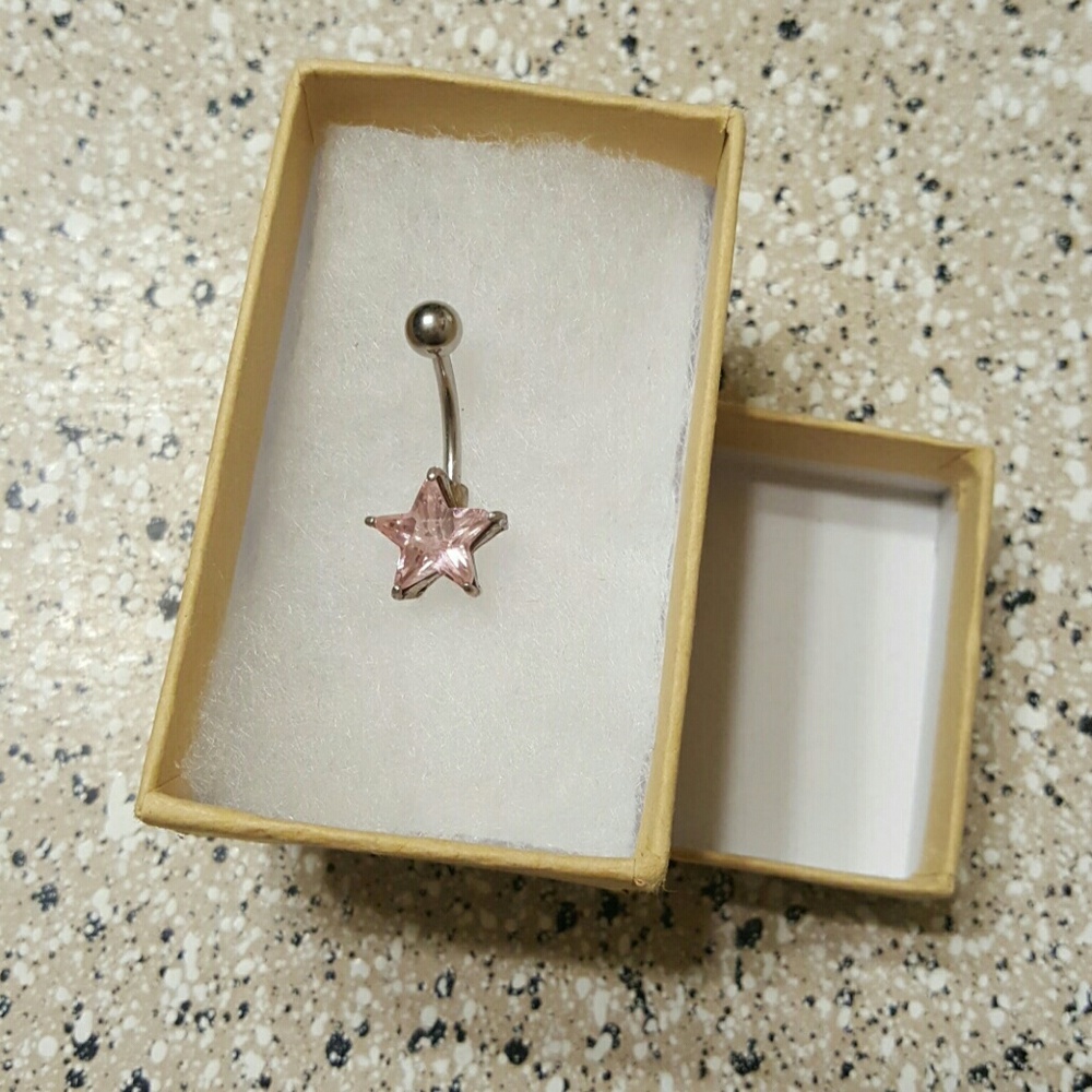 Never worn, silver and pink star belly ring
