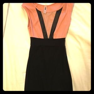 Women's nude and black form fitted dress