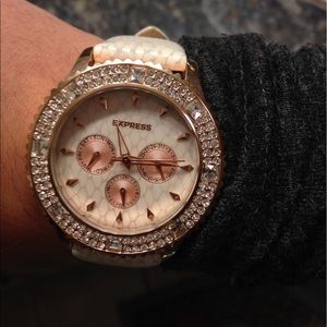 Express rose gold snake skin watch
