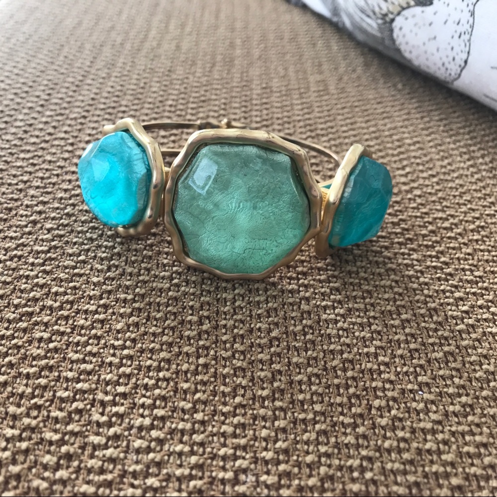 Gold toned bracelet with blue & green stones