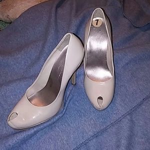 Nude heels with tiny peep toe