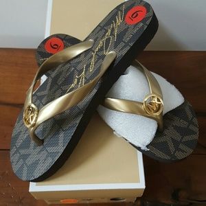 Michael Kors flip flops, women's size 6. NWT