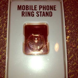 Mobile phone ring stand. New in box.