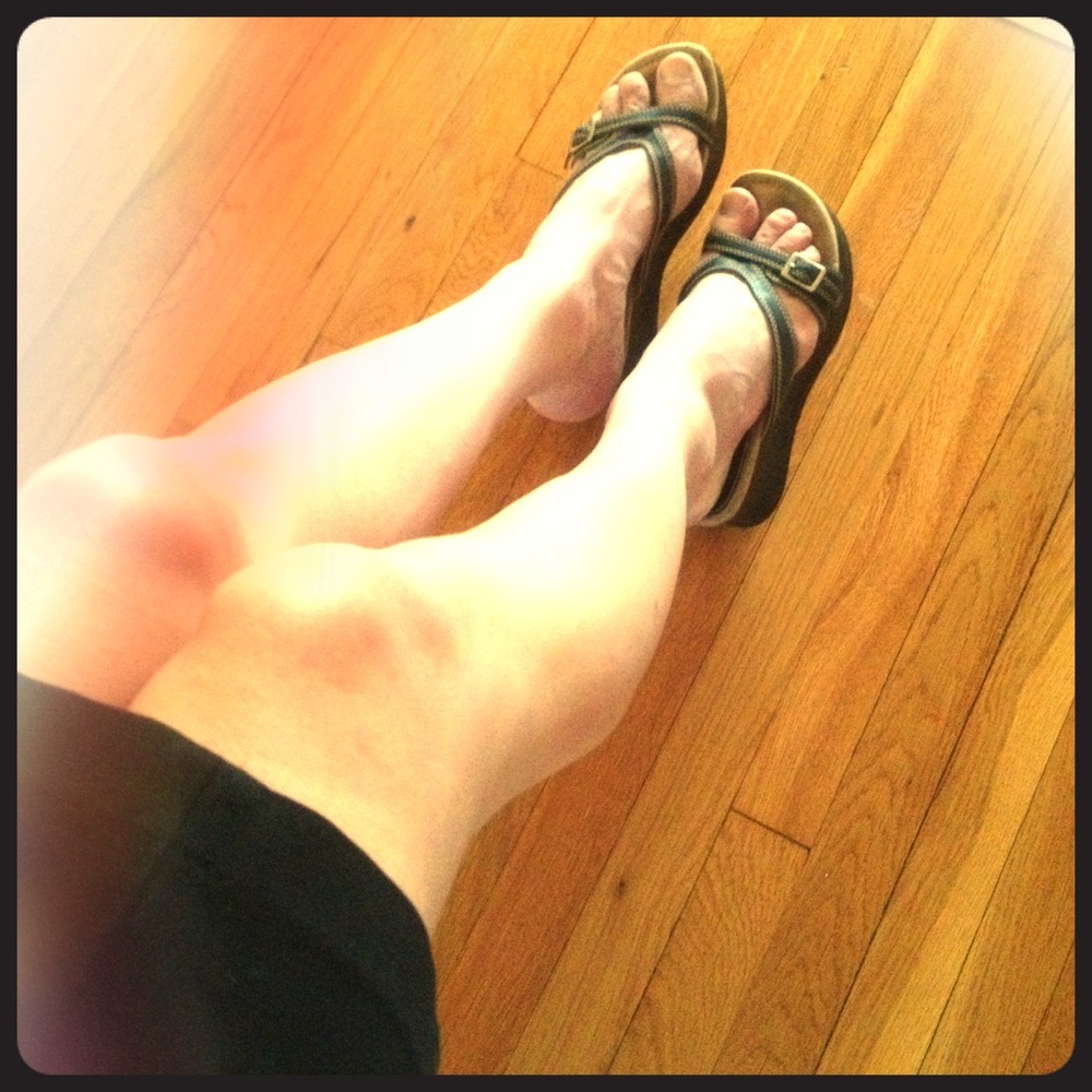 Well-worn sandals with toe imprints.