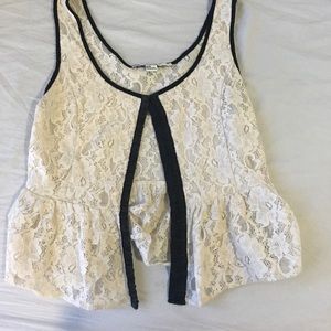 Cream and black peplum corset top