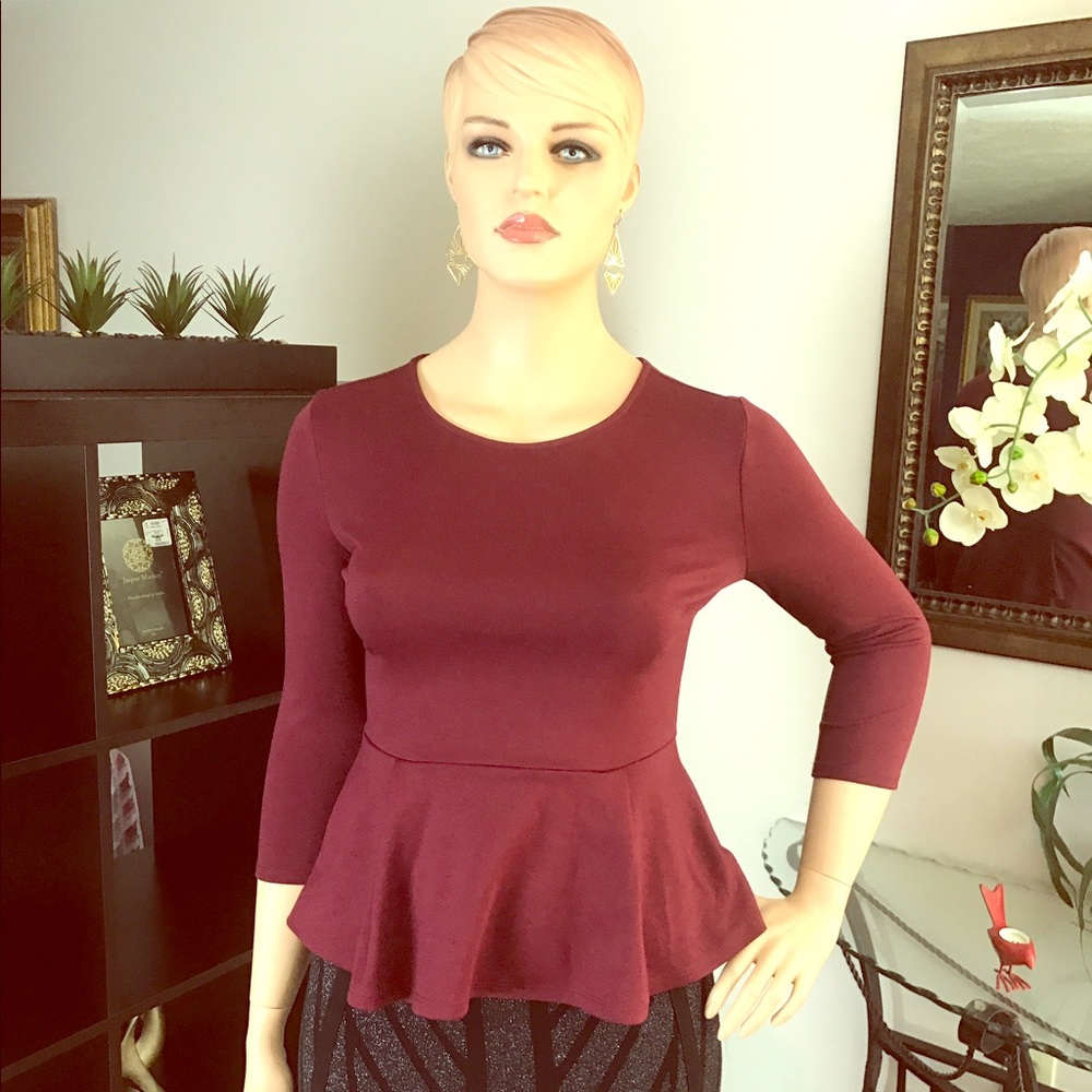 Plum peplum top with 3/4 sleeves. Size XL