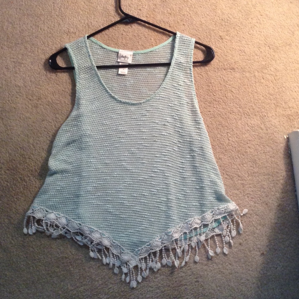 A crochet teal tank top
