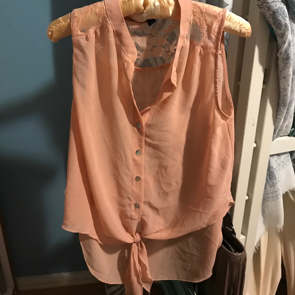 Peach waist tie top with lace.