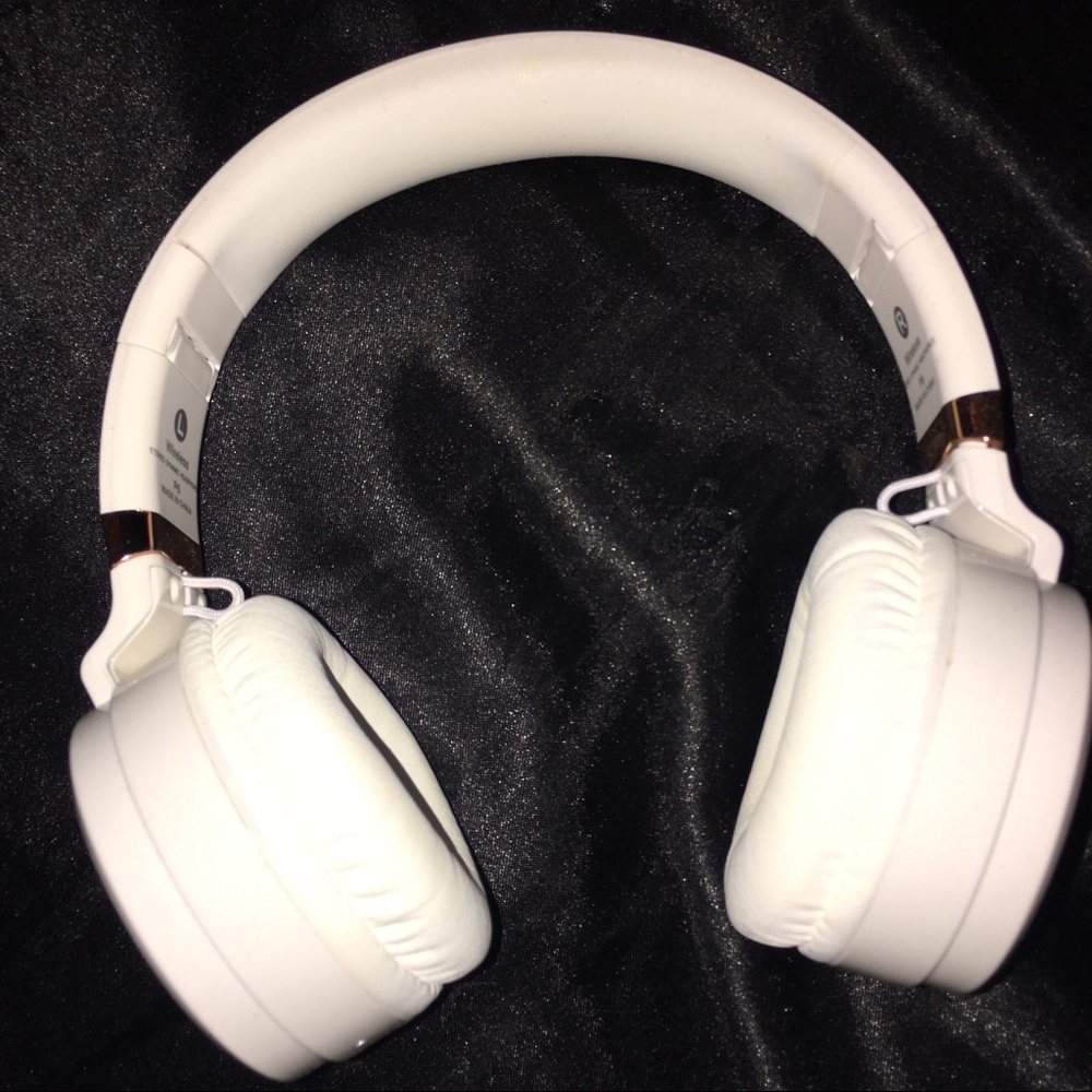 White and rose gold Bluetooth headphones