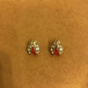Gold and coral lady bug studs.