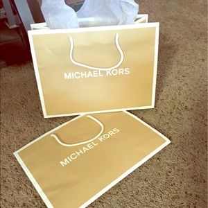 Two Michael Kors large shopping / gift bags.