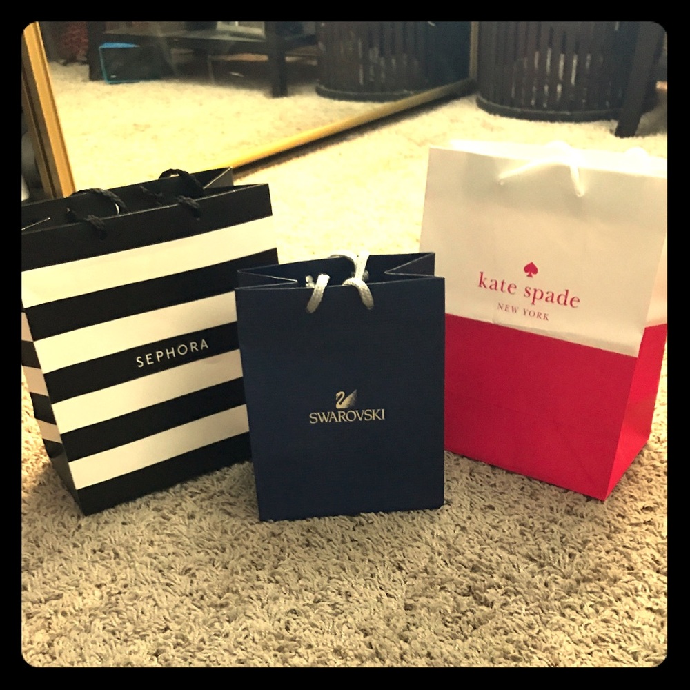 Shopping bags; Kate Spade, Sephora, and Swarovski.