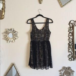 Black cocktail dress with lace skulls