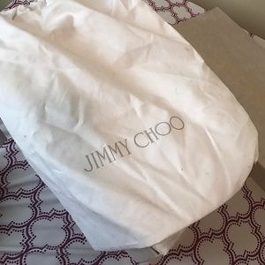 Gold Jimmy Choo shoes.