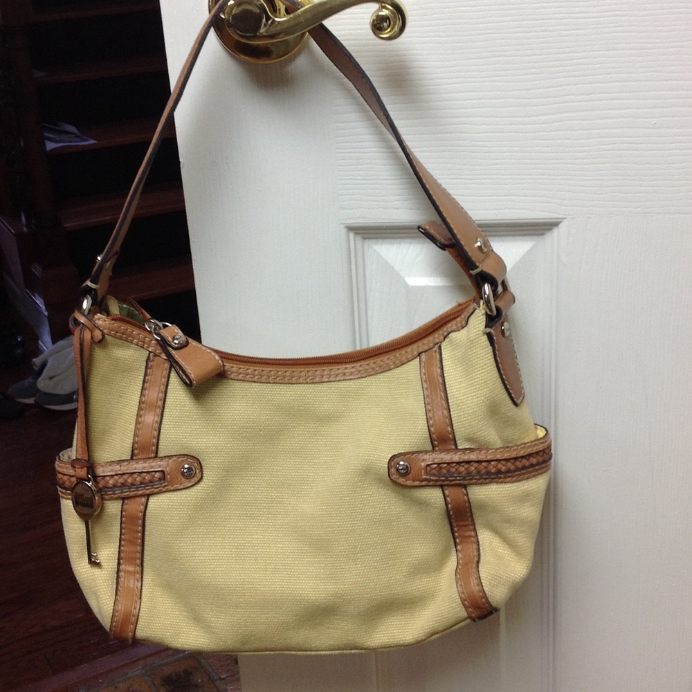 Tan Fossil purse trimmed in light brown straps