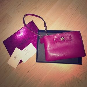 COACH pink wristlet