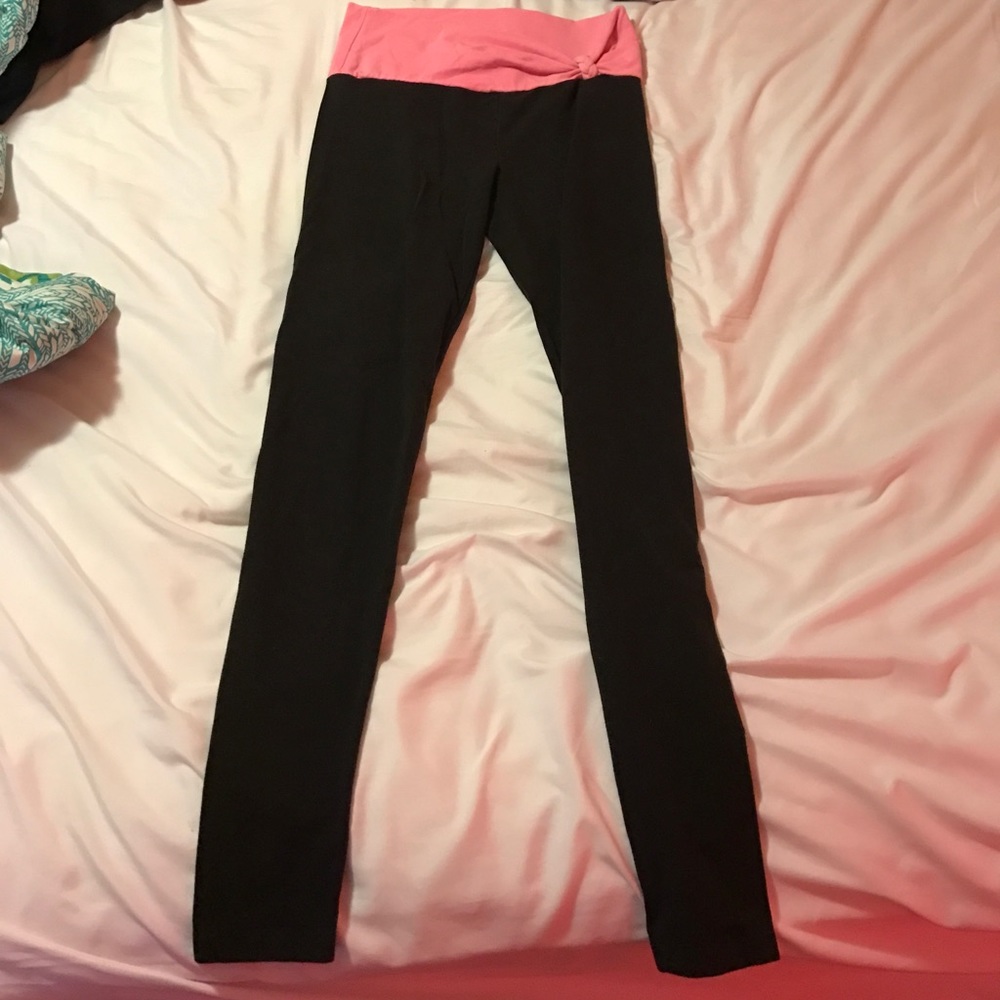 Black Victoria's Secret pink banded leggings.