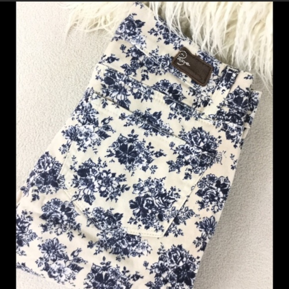 Paige white skinny jeans with blue floral print.