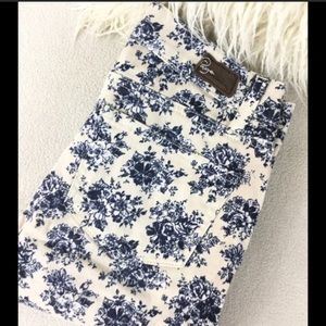 Paige white skinny jeans with blue floral print.