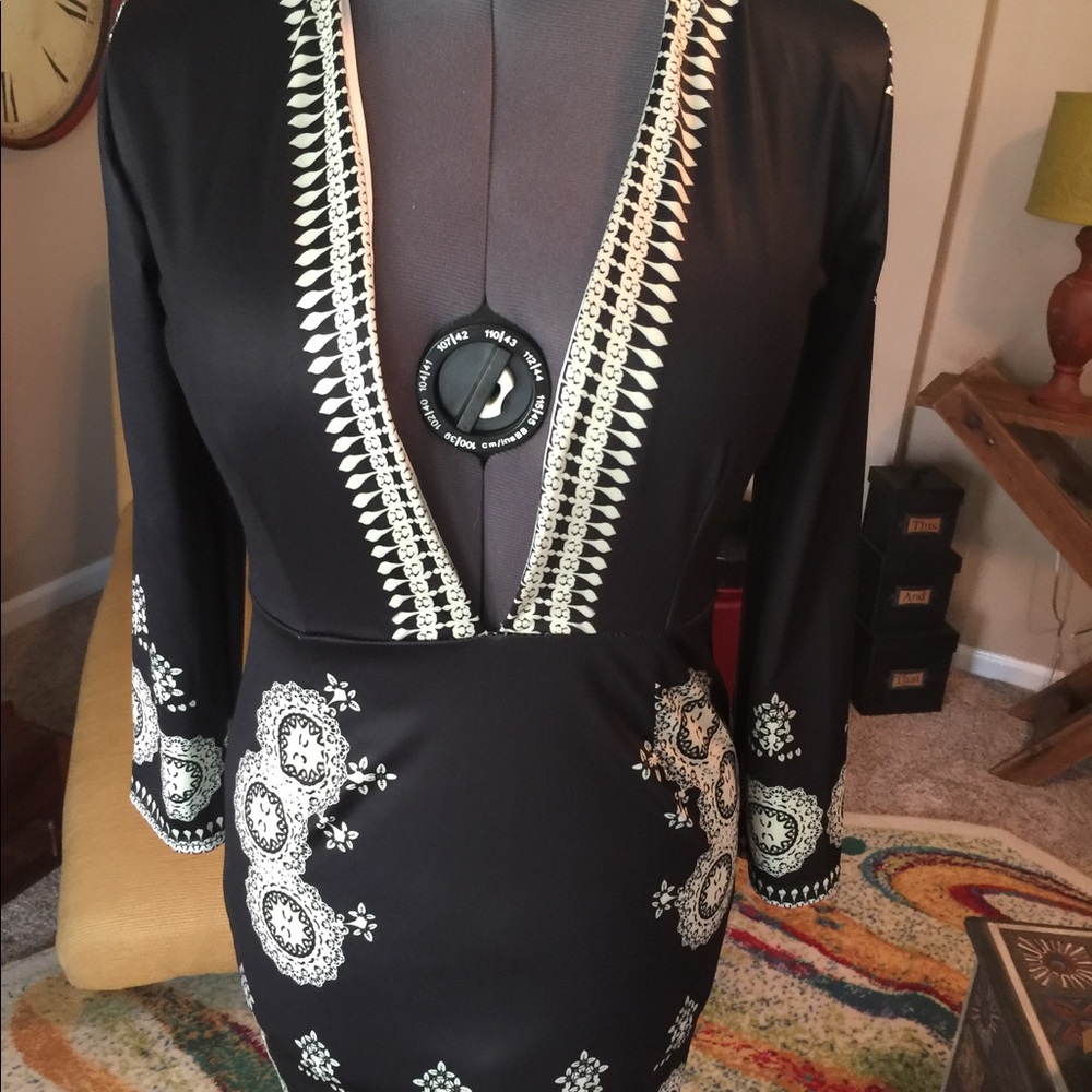 Black Dress w plunging neckline.