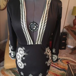 Black Dress w plunging neckline.