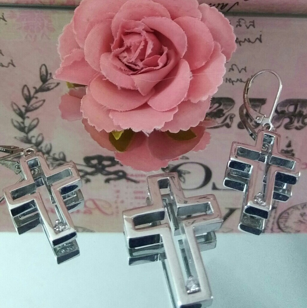 Cross necklace pendant and matching earrings.