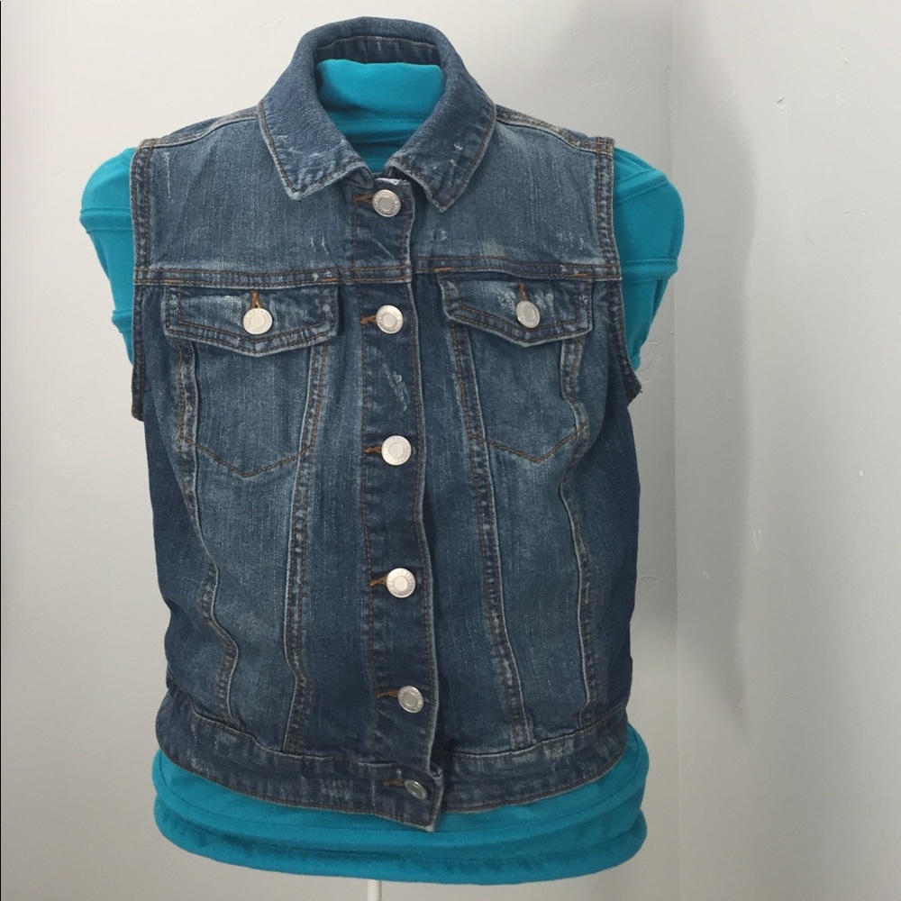 Distressed wash jean vest.