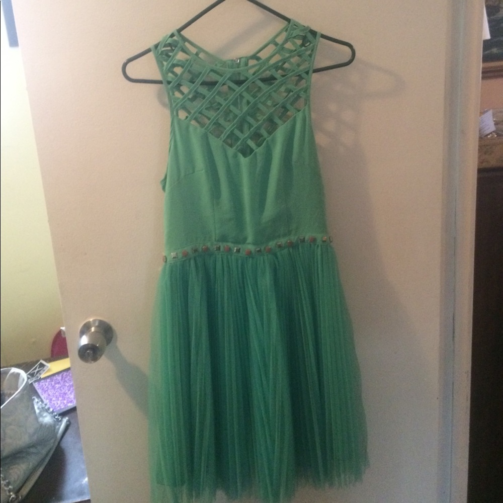 Light teal cocktail dress or prom dress .