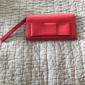 Kate Spade red bow clutch