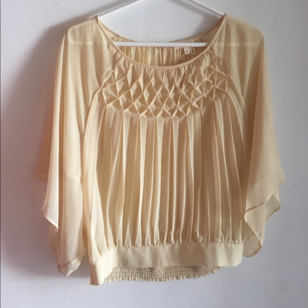 pleated blouse with banded hemline
