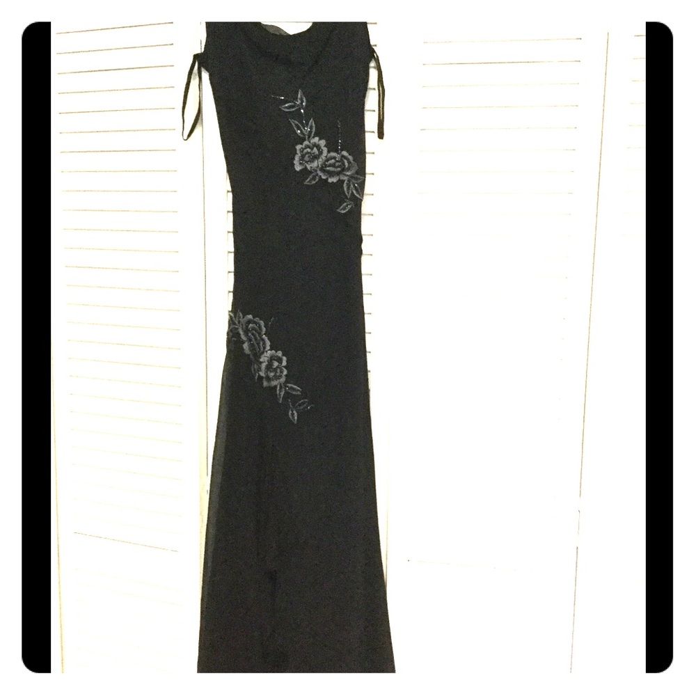 Black beaded dress with spaghetti straps.