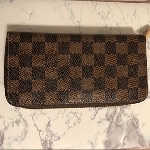 Brown checkered zippy wallet