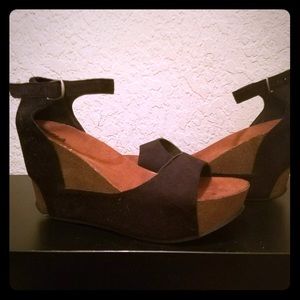 Black suede platforms sandals.