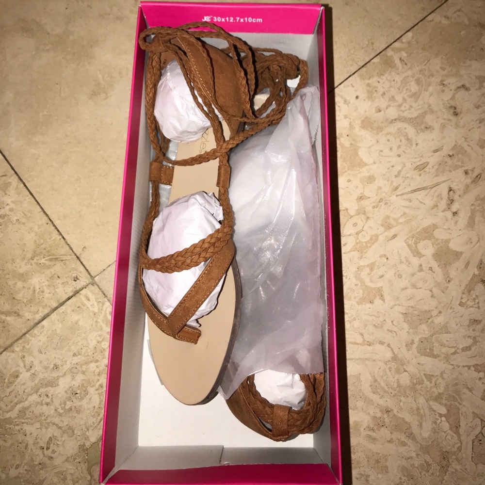 Brown tied up sandals