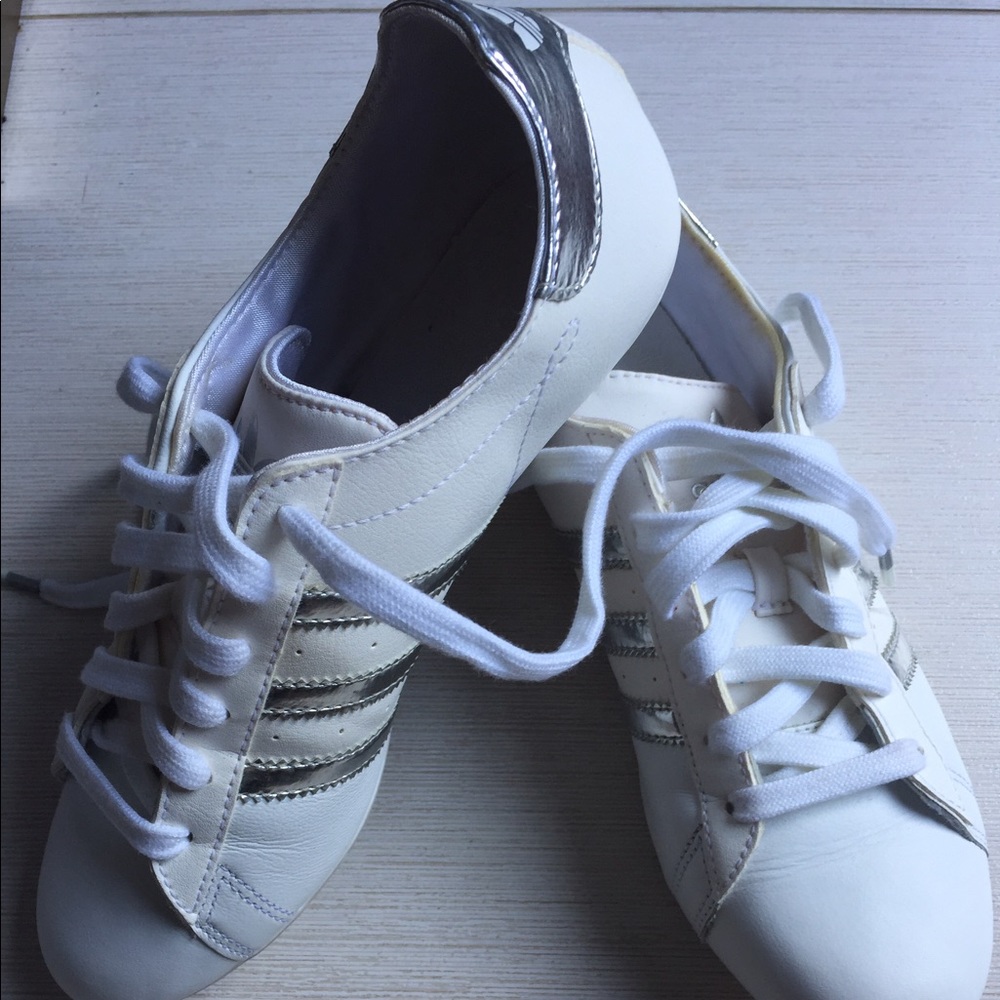 Adidas white leather sneakers with silver stripes