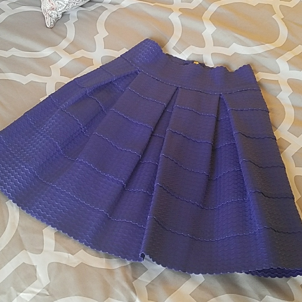 Francesa's purple pleated skirt