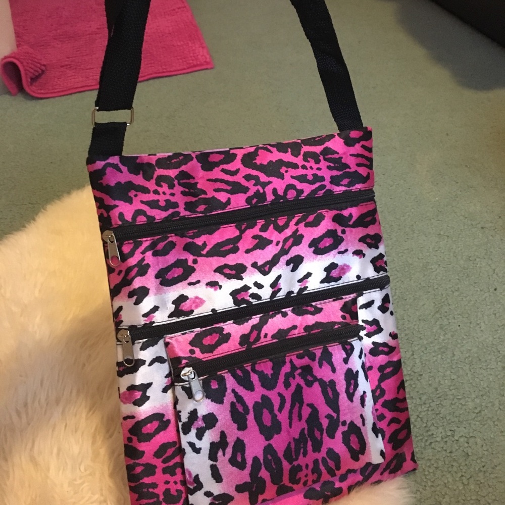 Never used. Pink Cheetah print cross-body bag