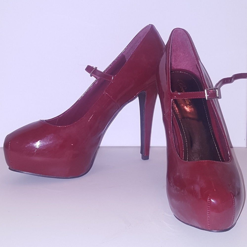Red patent leather pumps