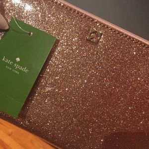 BNWT Kate Spade rose gold wristlet/clutch