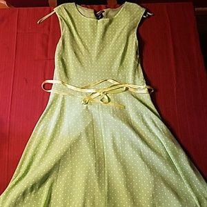 Green dress with white polka dots