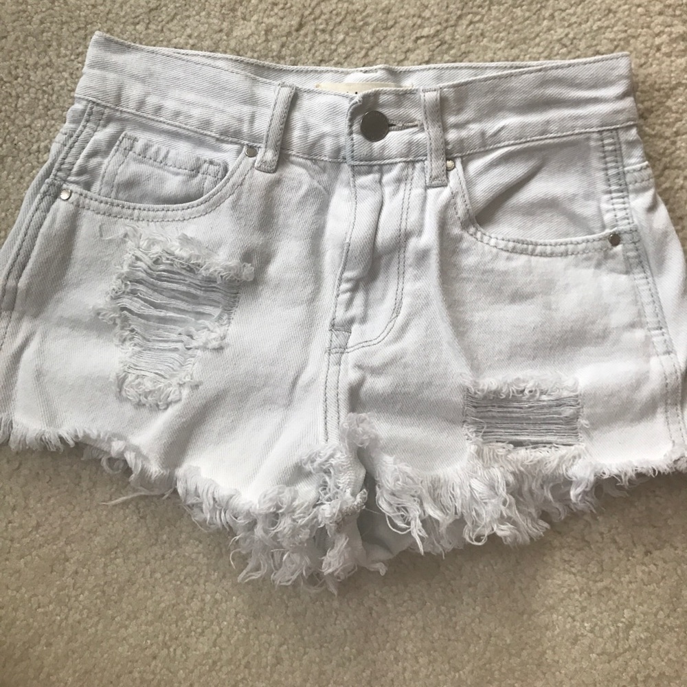 high waisted distressed white denim jeans