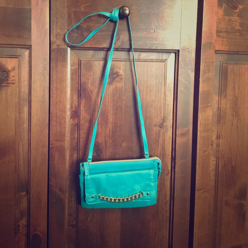 Light blue purse with gold accents
