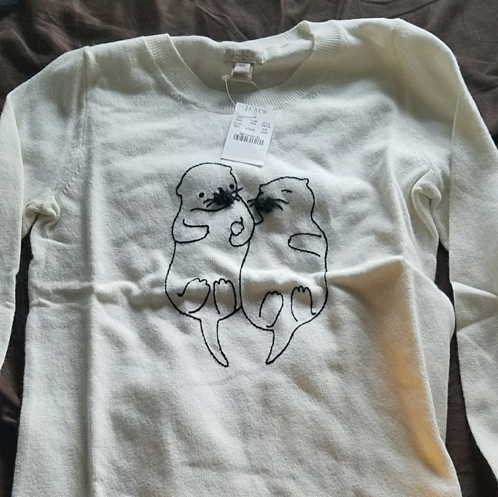 Cream sweater with otters