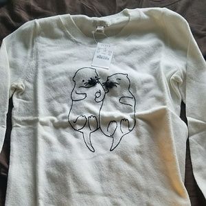 Cream sweater with otters