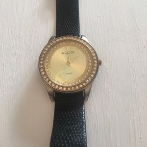 Black and gold aldo watch