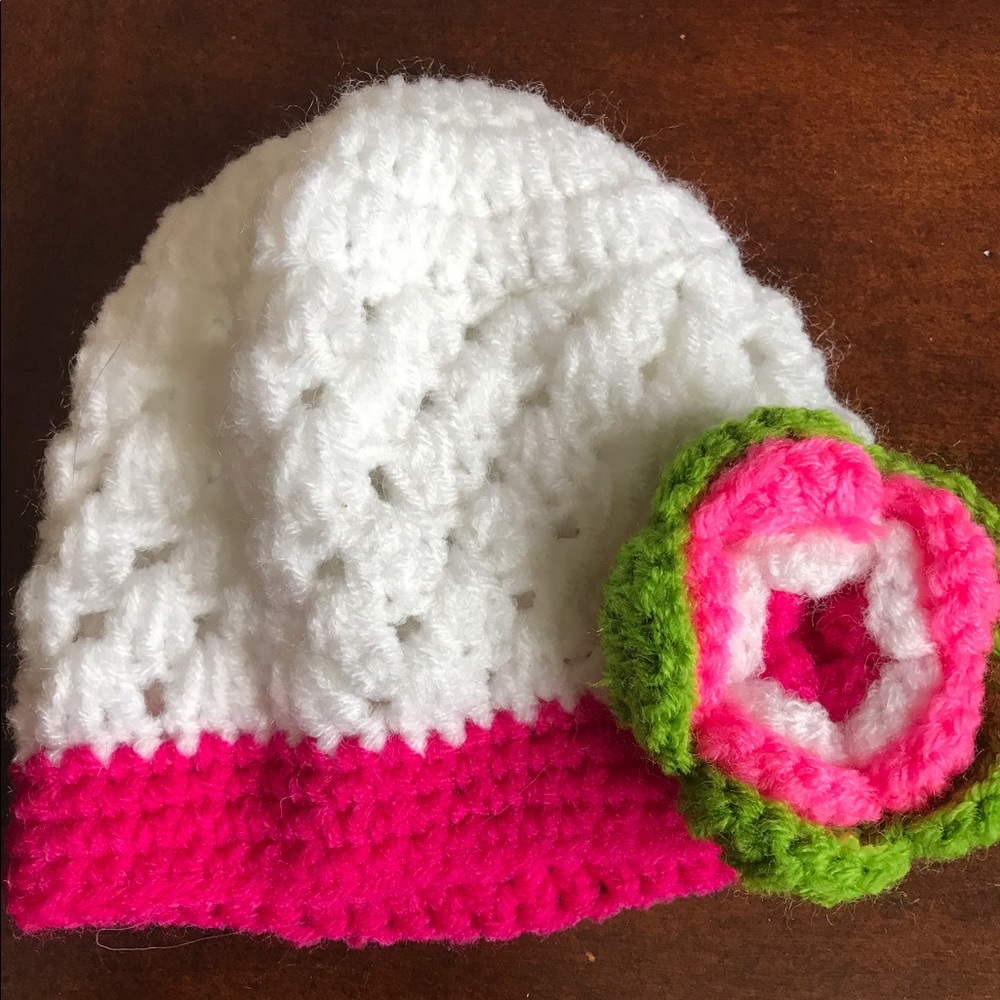 White and pink crocheted baby hat