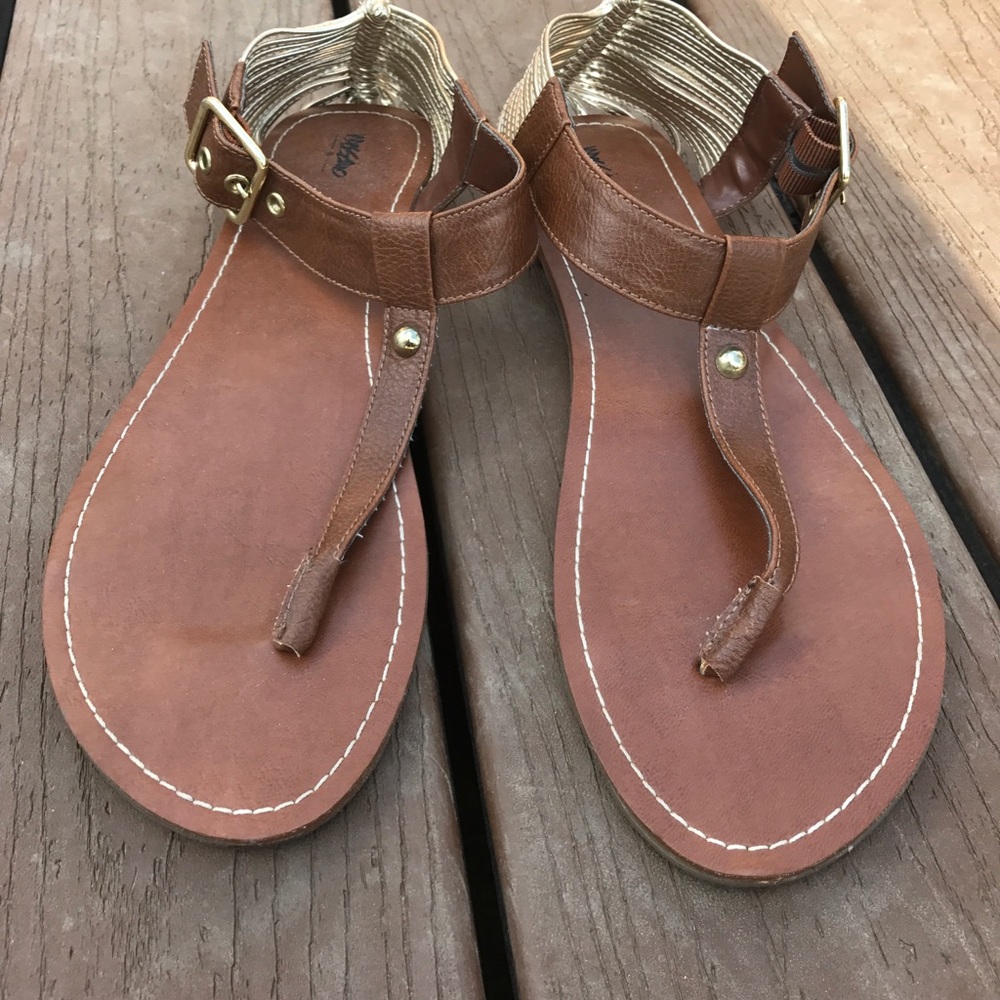 Brown and gold sandals.